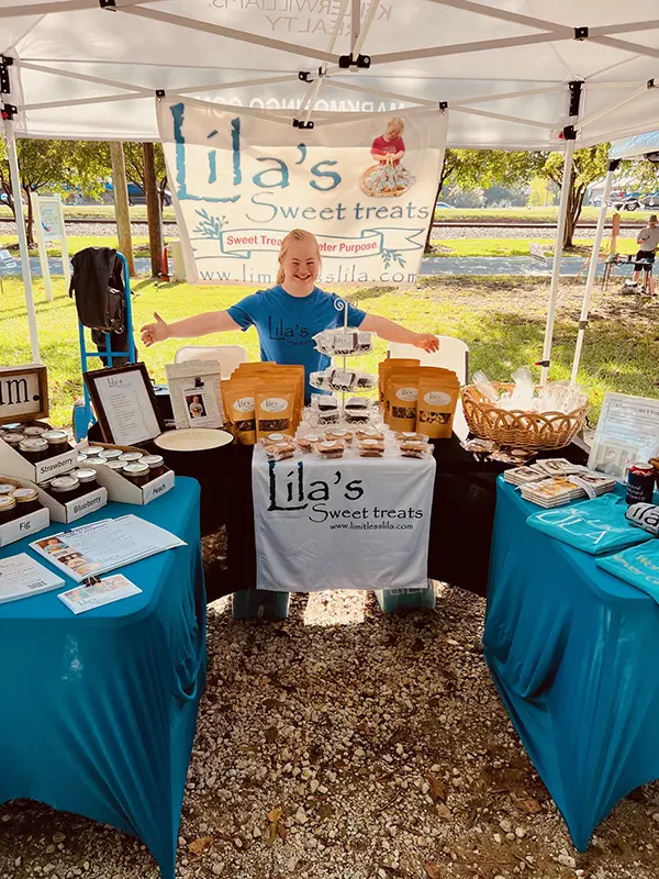 Lila with a display of her sweet treats